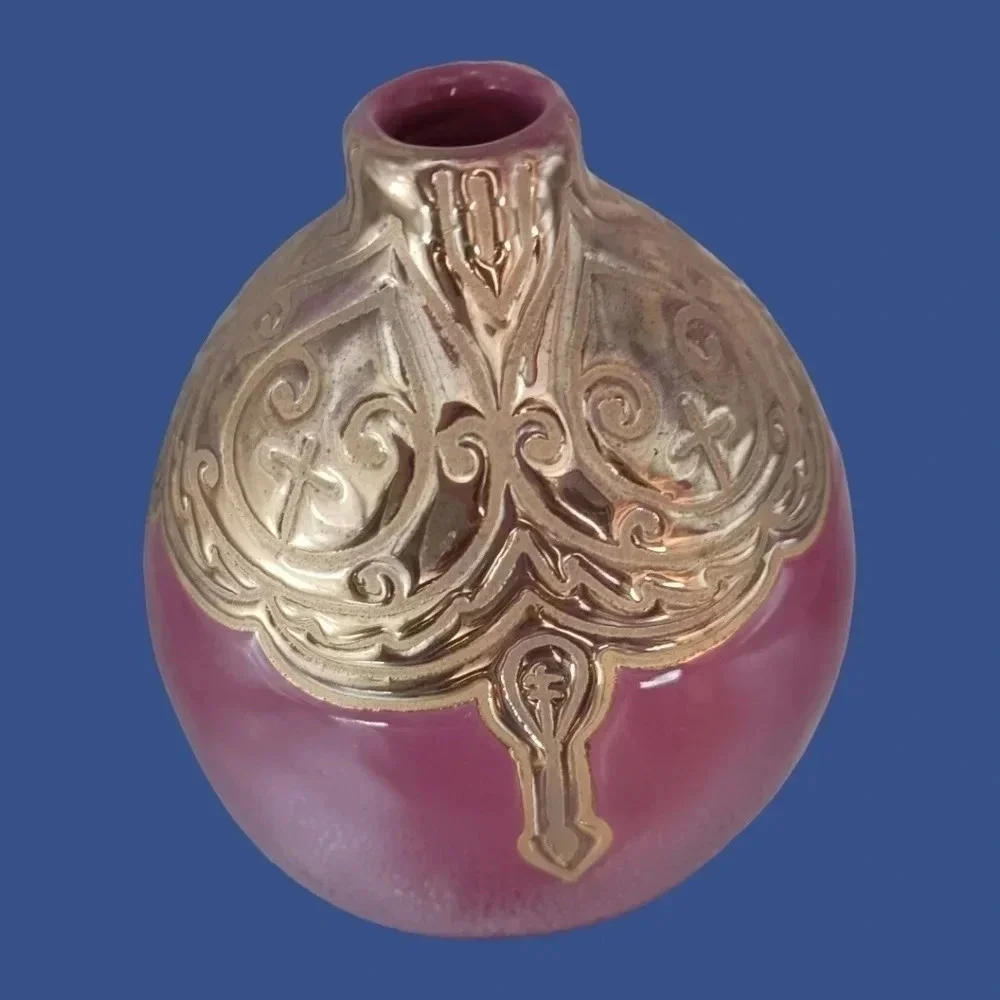Vintage ceramic engraved  vase topped with enameled gold glazed